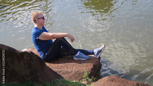woman sitting on a rock