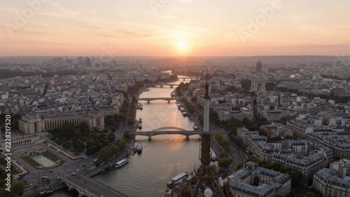 Eiffel Tower tip and Seine River at sunset in Paris France
