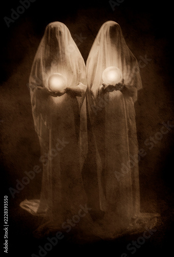 Two ghost figures holding glowing orbs against dark background