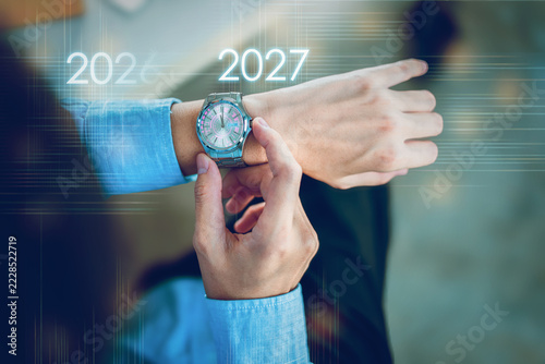 wristwatch symbolism with number 2026 Year the countdown welcome to Happy New Year 2027 representing the passage of time new beginnings changing trends and future goals.