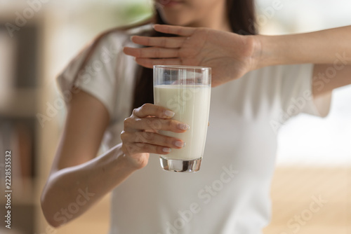 Fotografie Asian woman refusing glass milk expressing lactose intolerance allergy aversion