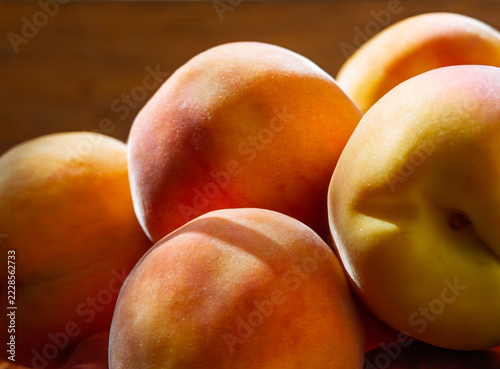 Fresh peaches in soft focus with rich orange and yellow hues