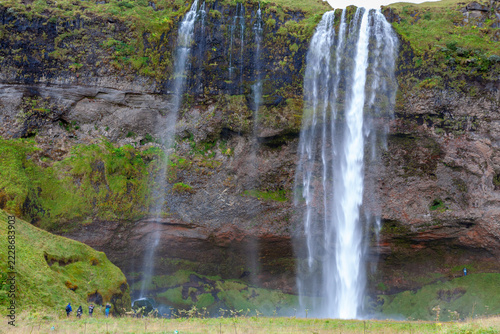 seljalandsfoss waterfall in south iceland with cliffs surrounding