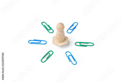Customer centricity concept with wooden figure surrounded by paper clips on white background