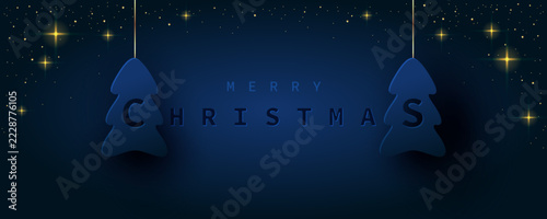 Christmas greeting card with christmas tree and small gold sequins on navy background