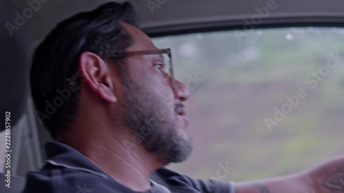 Mexican man driving car on a road trip to zacatlan puebla