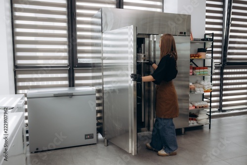 Female baker working in professional commercial kitchen