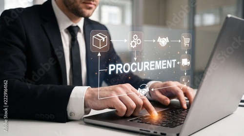 Businessman managing supply chain logistics using laptop with holographic interface