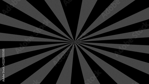 Black and gray sunburst pattern emanating from a central point with dramatic contrast