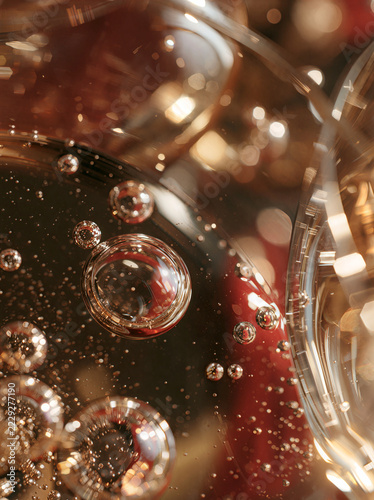 Macro of champagne bubbles rising in a crystal coupe
