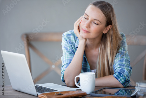 Tired Young Woman Taking a Break From Laptop Work