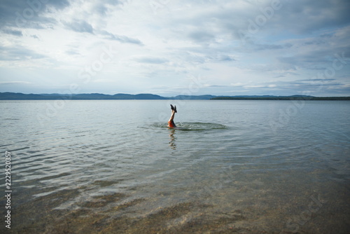 A young boy swimming in Batchewana Lake in Ontario, Canada.