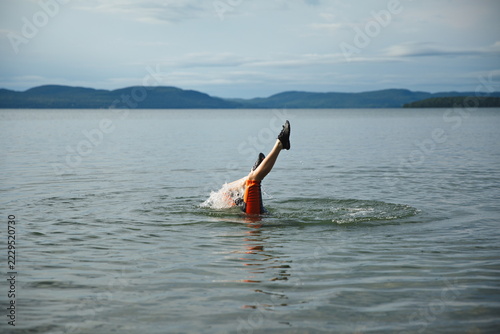 A young boy swimming in Batchewana Lake in Ontario, Canada.