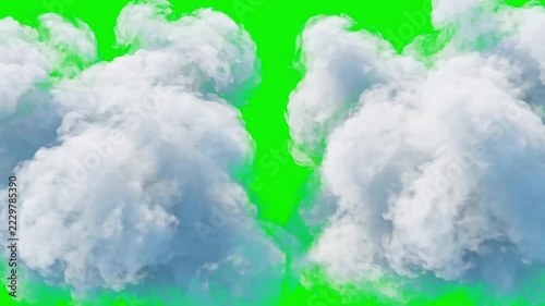 Fluffy white cumulus cloud floating slowly across a bright vibrant green chroma key screen background