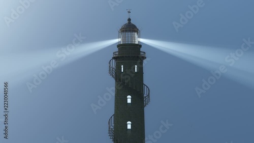3d animation of an old lighthouse with the searchlight beam rotating