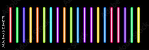 Set of glowing neon tubes and bright fluorescent light sticks shining on a dark