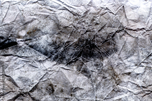Texture background of a worn, crumpled paper surface; a gray grunge background.