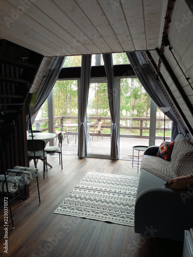 Interior of A-frame cabin, interior design, living room.