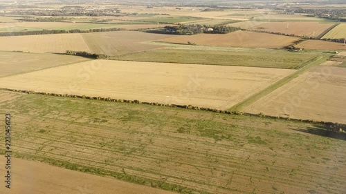 Aerial view of agricultural fields and farmland from airplane window