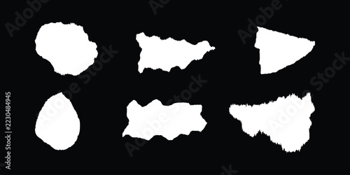 Torn paper against a black background jagged edges visible