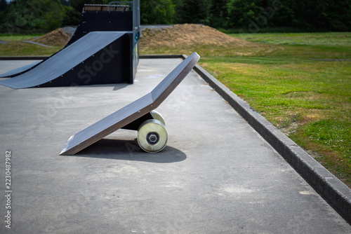 ABSTRACT ART OF A SKATEBOARD USED AS A SKATE RAMP AT A LOCAL SKATE PARK IN STANWOOD WASHINGTON