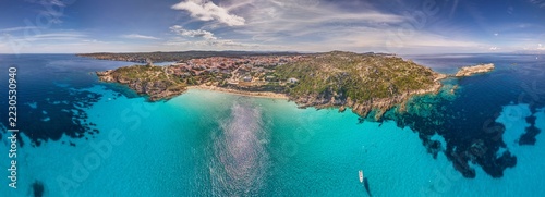 Rena Bianca turquoise beach and headland aerial panorama Sardinia