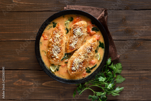 Chicken breast in creamy sauce with tomatoes and spinach