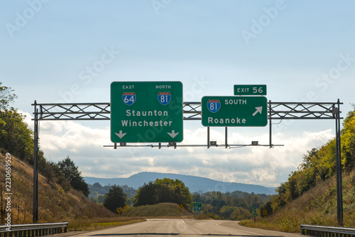 exit signs at the intersection of Interstate 64 and Interstate 81 in Lexington, Virginia. I-81 North toward Staunton and Winchester, and I-81 South toward Roanoke, Virginia