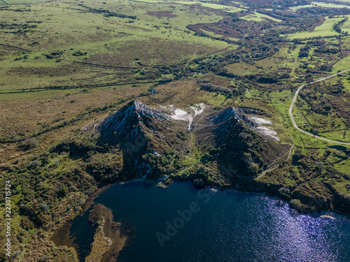 Aerial view of conical spoil heaps at abandoned china clay pits in Glynn Valley Cornwall
