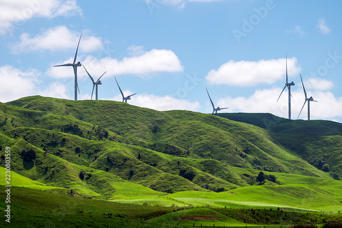 A series of wind turbines along the ridge of the Tararua Ranges in the Manawatu region of New Zealand. as seen from the Mako Mako road to the east of the turbines