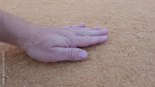 Hand Checking the Texture and Firmness of Wood Fiber Insulation