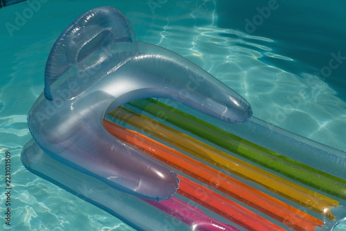 Inflatable tube floating in a swimming pool