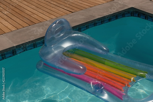 Inflatable tube floating in a swimming pool