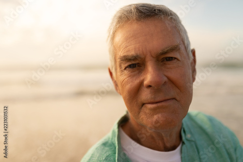 Active senior man standing on the beach