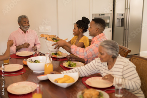 Multi-generation family having meal together