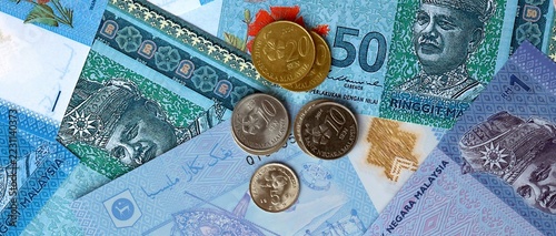 Obraz na plátně Malaysian ringgit money notes and coins on table