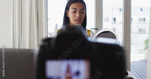gender fluid vlogger recording a make up vlog at home