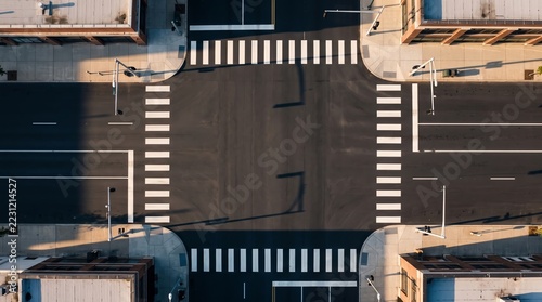 Aerial View of Urban Intersection with Pedestrian Crossings and Traffic Lights