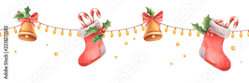 Red Christmas stockings with candies, bells, holly, and string lights. A seamless border pattern for Christmas, New Year, and the winter season. A long banner suitable for design, decoration, framing.