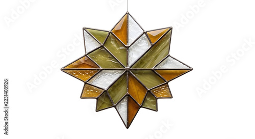 Geometric stained glass star suncatcher ornament in amber and green earth tones, isolated on white background.