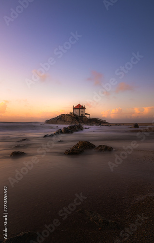 chapel senhor da pedra on miramar beach,porto. vertical travel banner 