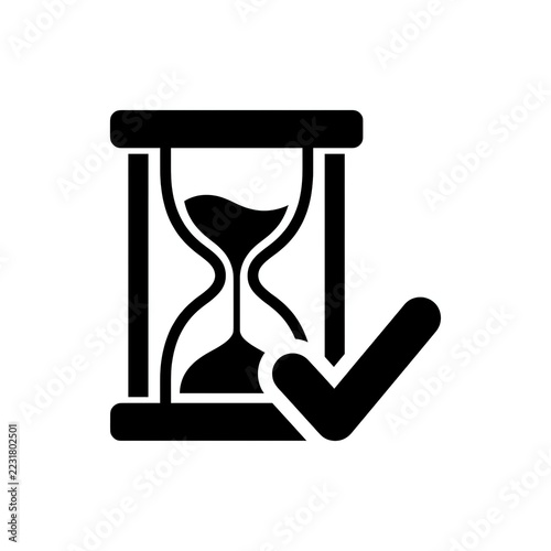 Obraz na plátně Minimalist black hourglass icon with a checkmark symbol representing completed t