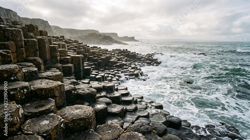 Basalt columns meeting ocean waves on a rugged coast