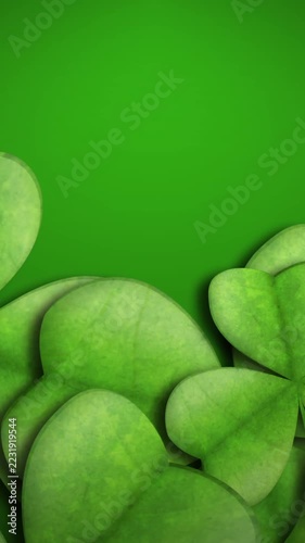 Vertical video: On play clover leaves rising from bottom, gently shifting light, fading for text