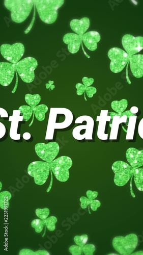 Vertical video: Looping, glitter clovers drifting, white St