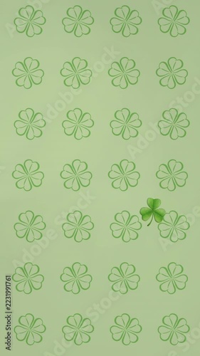 Vertical video: Solid glossy clover appearing then drifting across tiled grid, highlighting pattern