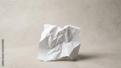Crumpled White Paper Ball On Minimalist Neutral Background
