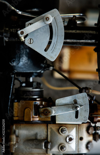 Vintage machine lever and gauge showing open control