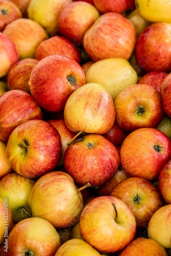 Fresh organic red and yellow apples pattern, farmers market, background.