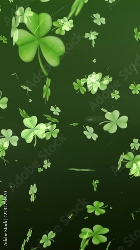Vertical video: Light sweep starting clovers falling and rotating, pulsing to make depth